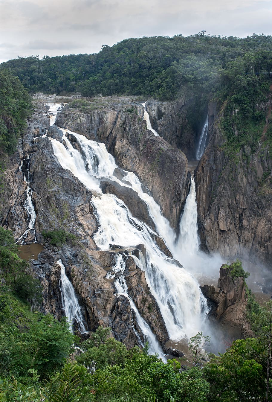 waterfalls lined with trees under grey cloudy sky, scenics - nature HD wallpaper