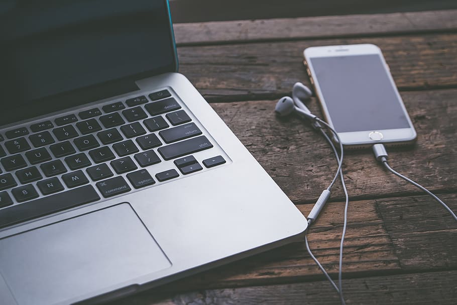 Macbook Pro and Iphone on Wooden Surface, desk, device, earphones HD wallpaper