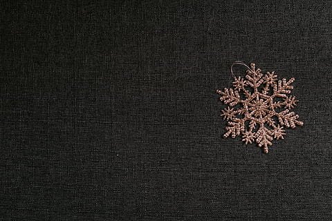 brown snowflake patch on black textile, rug, home decor, linen HD wallpaper