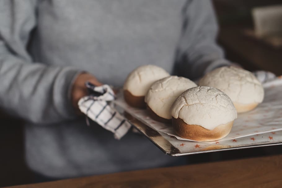 four baked breads, food, one person, food and drink, midsection HD wallpaper