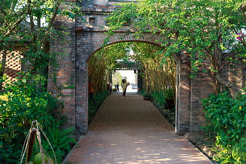 Walkway With Arched Brick Wall, architecture, bricks, building HD wallpaper