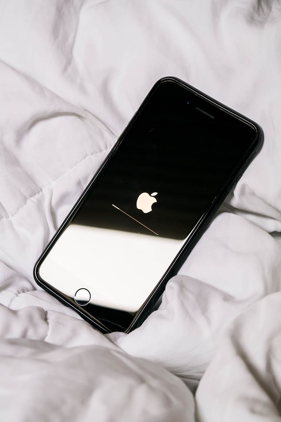 turned-off black iPhone, bedding, apple, reflection, minimal