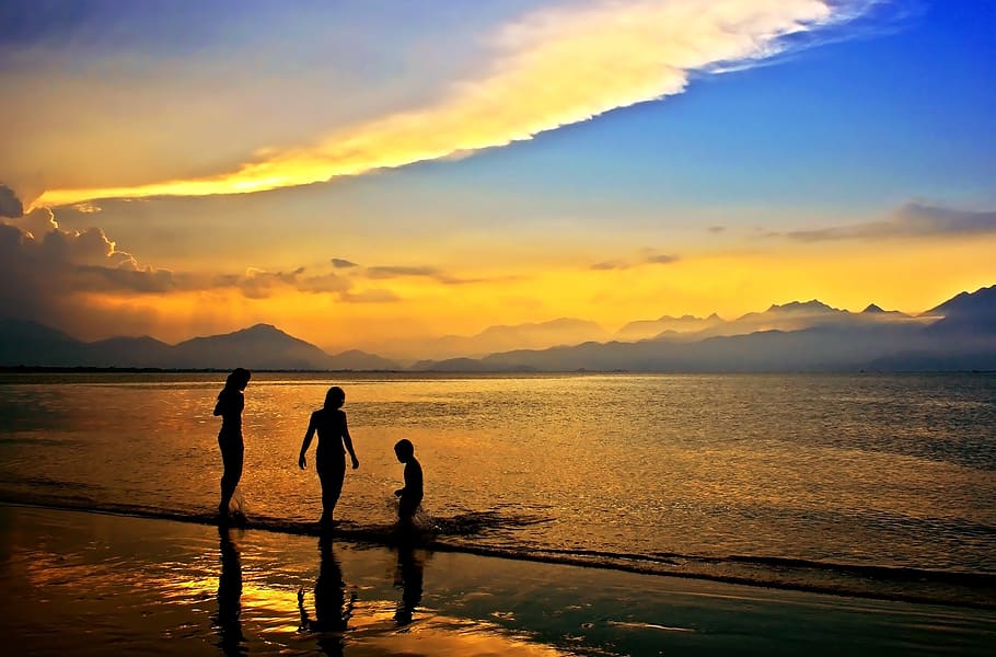 Silhouettes of 3 People in Body of Water during Dawn, beach, clouds HD wallpaper