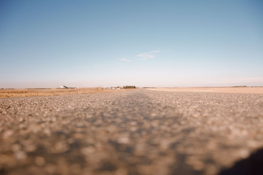 brown concrete road during daytime, ground, nature, tarmac, outdoors HD wallpaper
