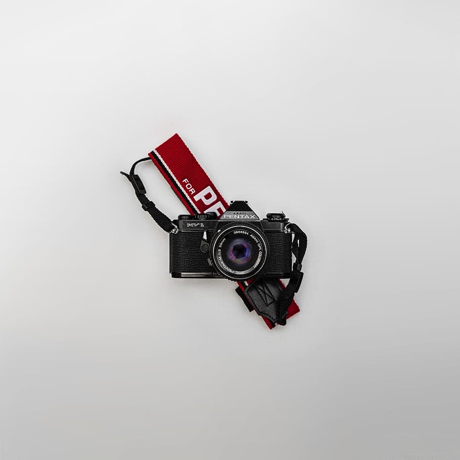 Black and Gray Pentax Bridge Camera on White Surface, close-up HD wallpaper