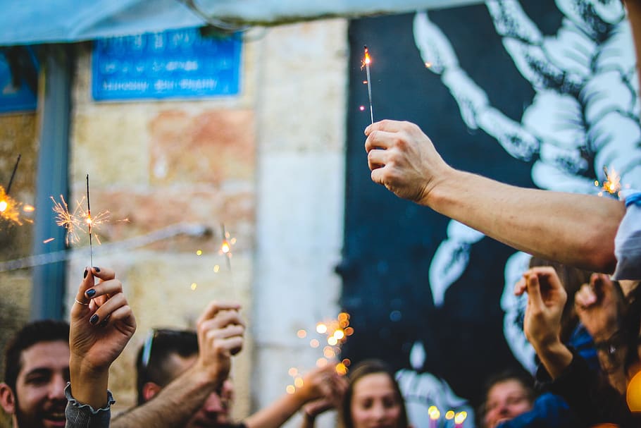 people holding firecracker sticks, happybirthday, company, goodtime HD wallpaper