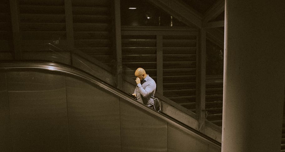 man riding on escalator, handrail, banister, human, person, railing HD wallpaper