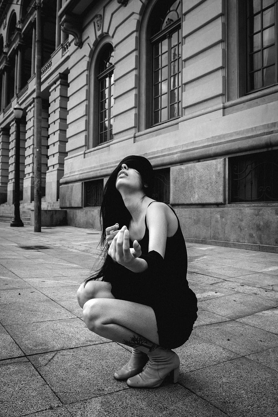 Woman Crouching on Pavement Near Building, architecture, black and white, HD wallpaper