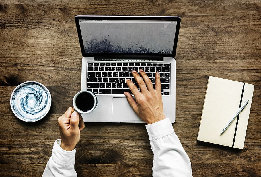 Person Holding Black Ceramic Cup and Macbook Pro, beverage, browsing HD wallpaper