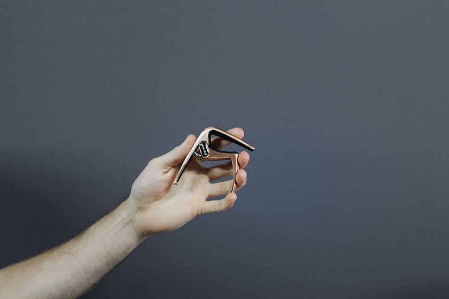 gold guitar capo, human, person, finger, hand, musical, musician HD wallpaper