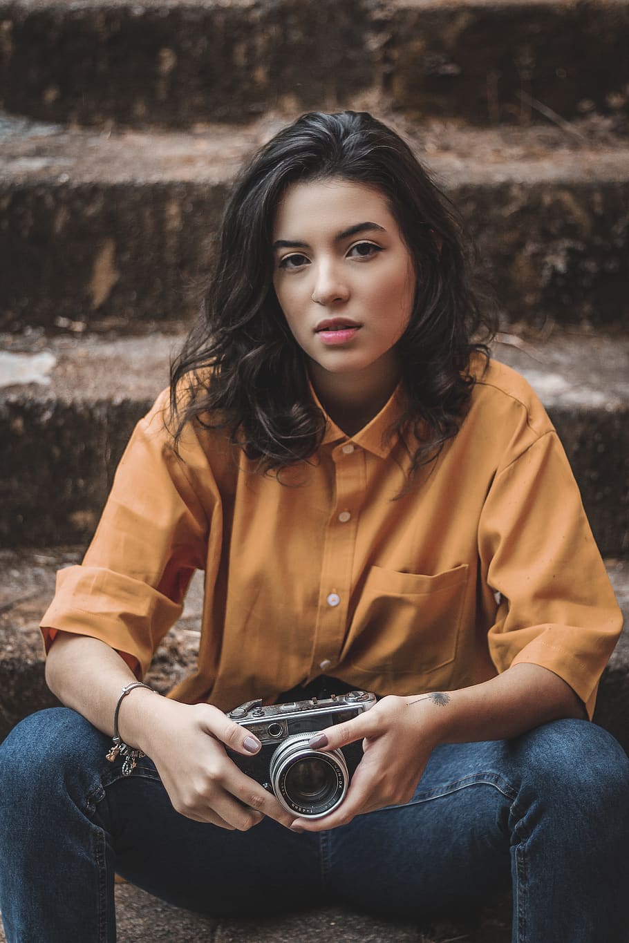 Woman Sitting Down and Holding Camera, beautiful, cute, facial expression HD wallpaper
