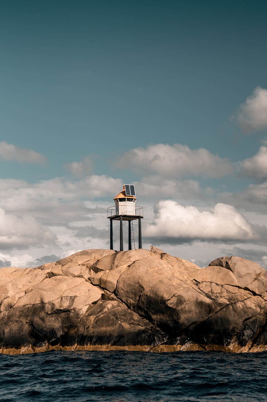 lighthouse on stone, beacon, sea, outdoors, ocean, nature, water HD wallpaper