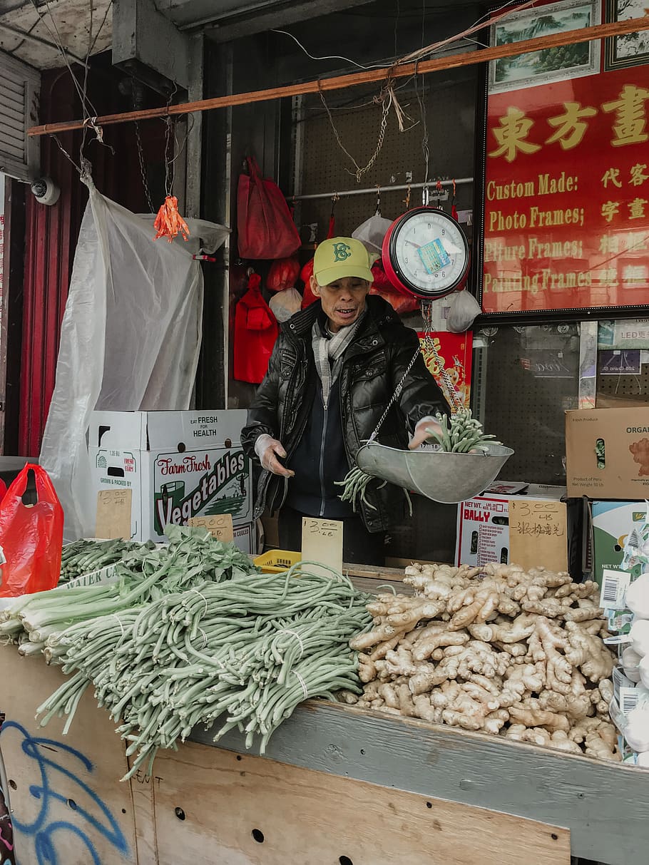 man standing beside vegetable stand, person, human, people, market HD wallpaper