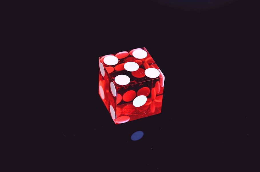 Red Translucent Die on Top of Black Surface, black background HD wallpaper