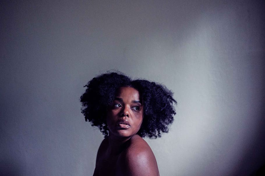 woman's black hair, portrait, person, afro, looking away, depressed