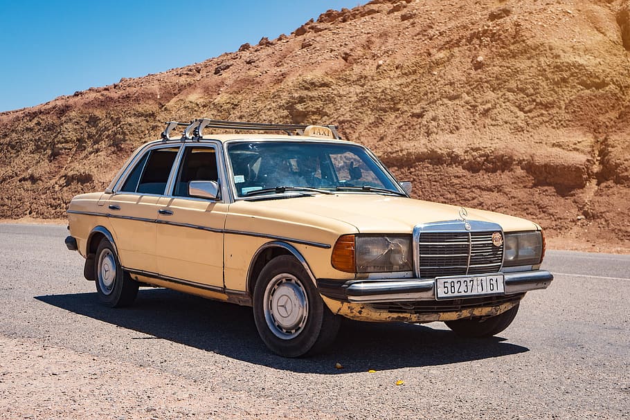 beige Mercedes-Benz sedan parked near mountain, car, vehicle