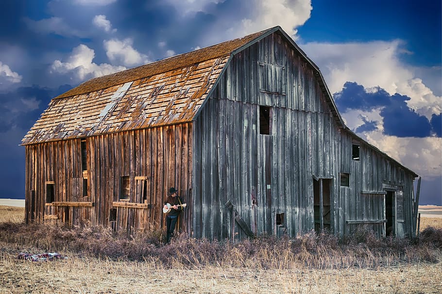 Person Holding Guitar While Leaning on Barn, abandoned, cabin HD wallpaper