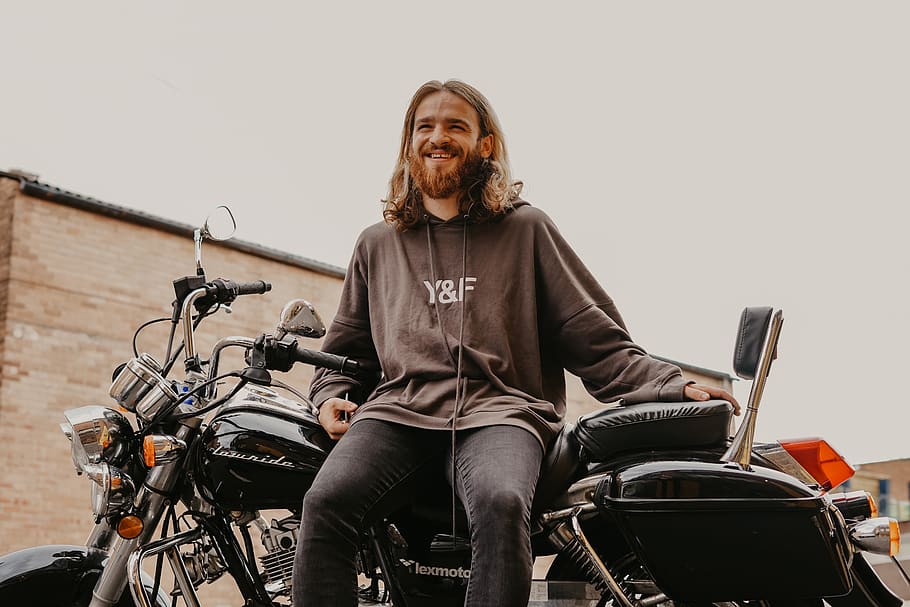 man sitting on cruiser motorcycle, human, person, apparel, clothing HD wallpaper