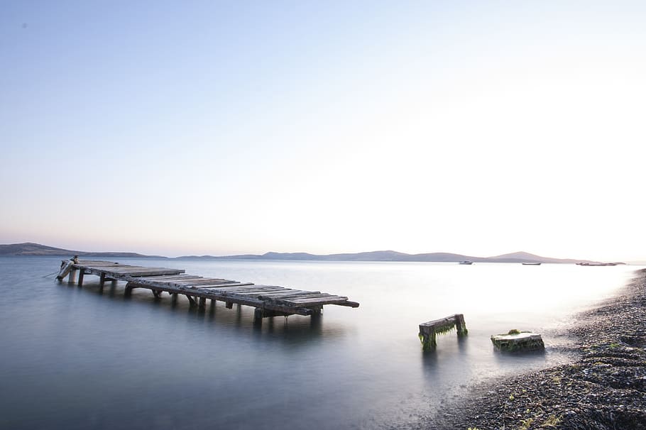 Brown Wooden Dock on Misty Body of Water, beach, boats, clouds HD wallpaper