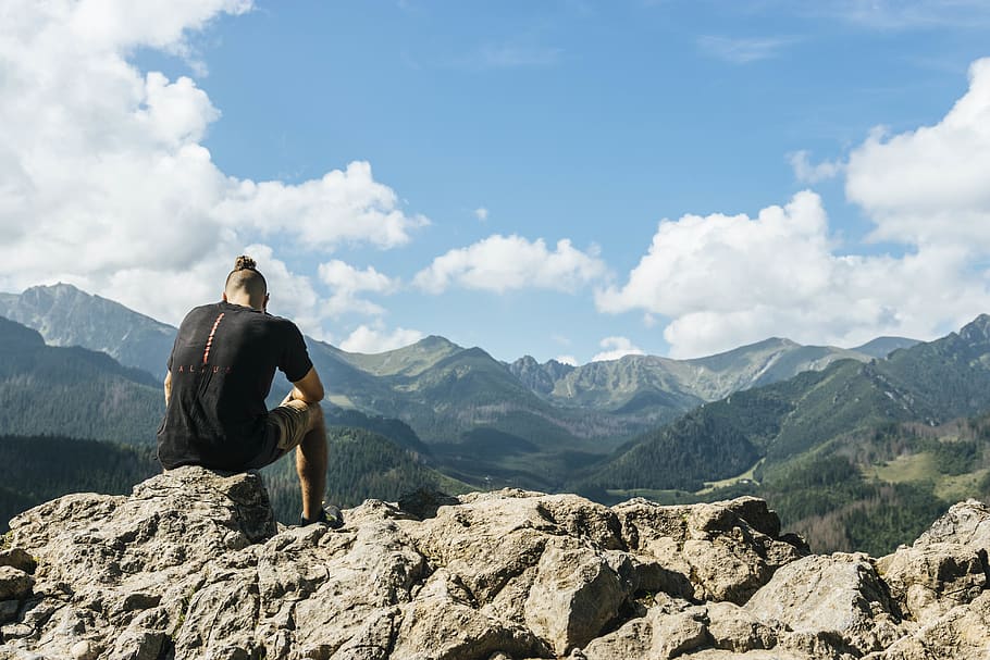 Man Sitting on Rocks Within Mountain Range, blue sky, climb, climber HD wallpaper