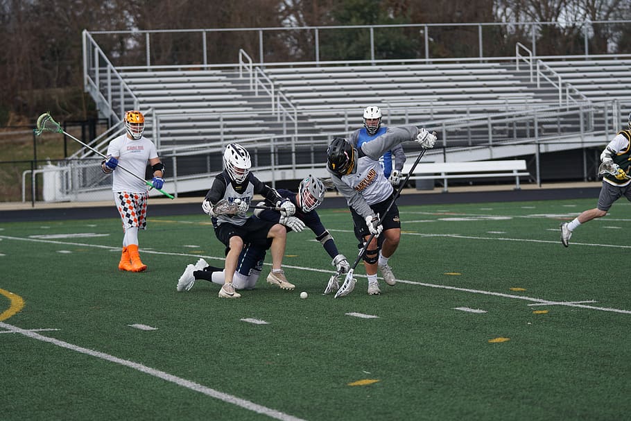men playing lacrosse in field, human, person, clothing, apparel