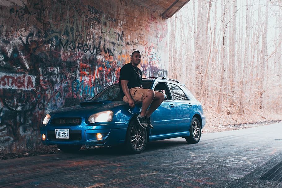 Man Sitting on Blue Vehicle, car, classic, driver, graffiti, parked HD wallpaper
