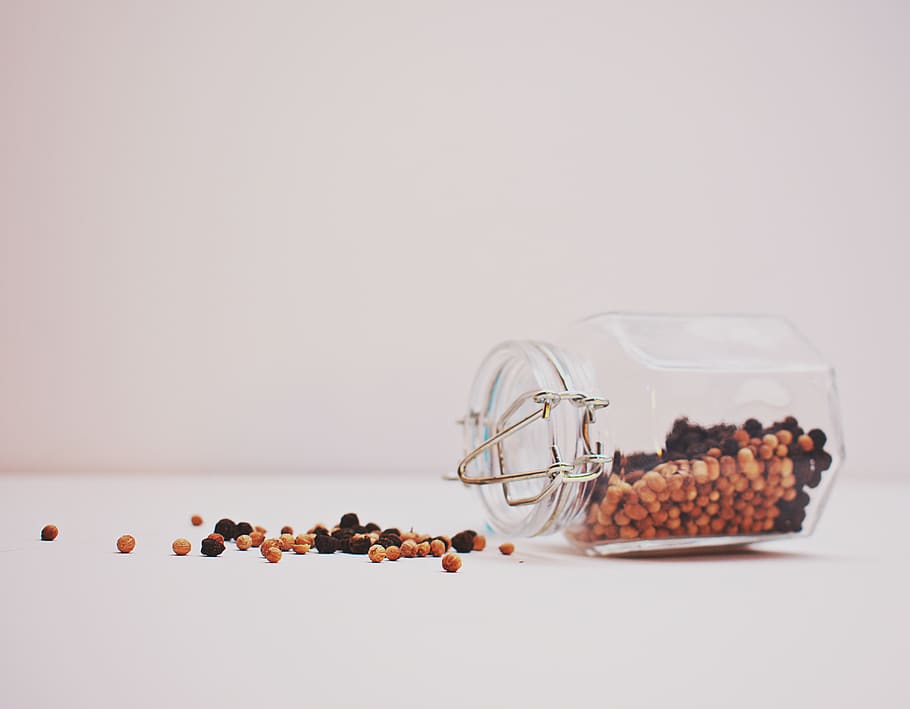 Black and Brown Peppercorns Spilling from Glass Jar, background HD wallpaper