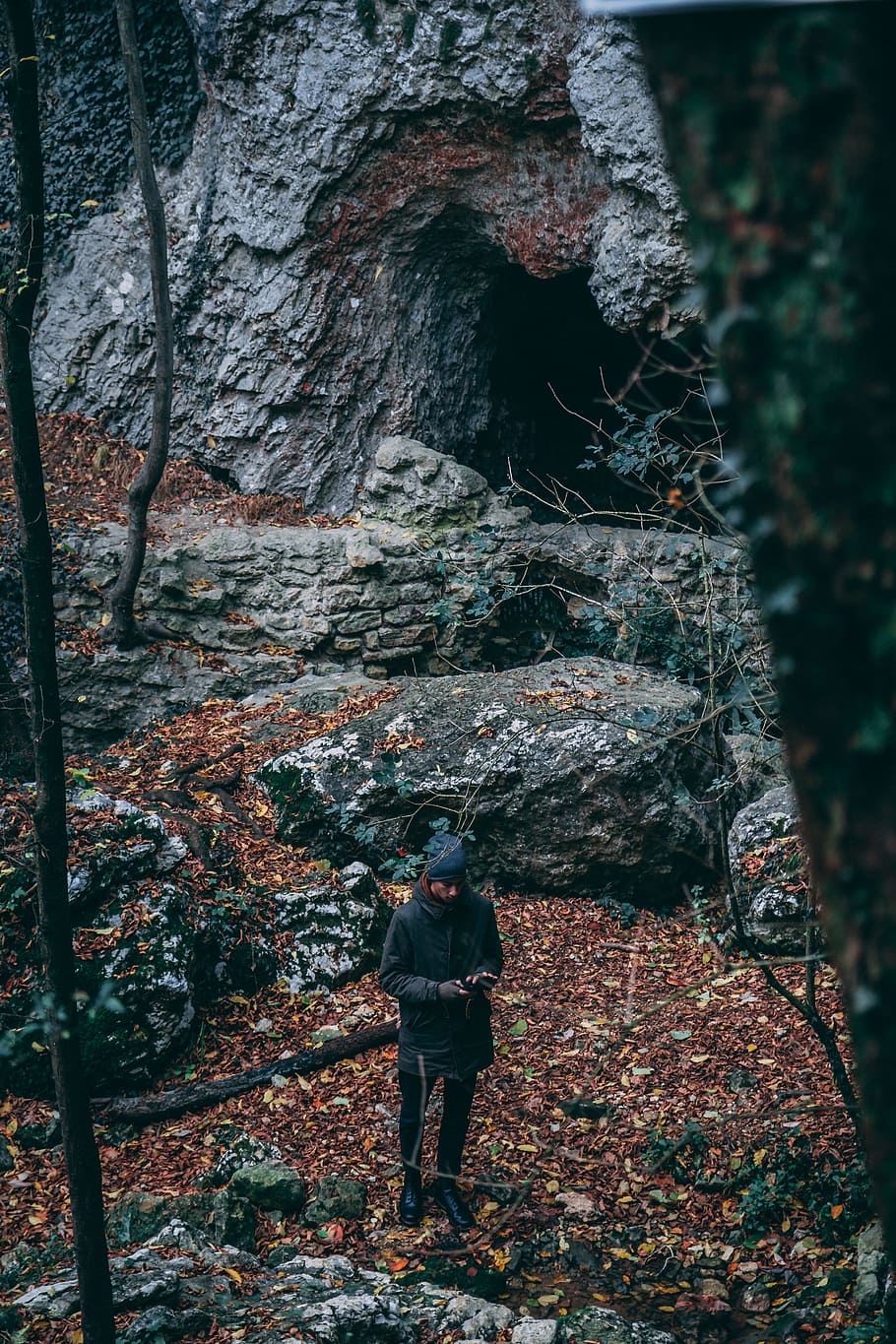Man In Black Coat Standing Near Cave, alone, autumn, daylight HD wallpaper