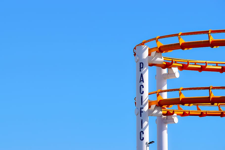 roller coaster under blue sky, inflatable, santa monica pier