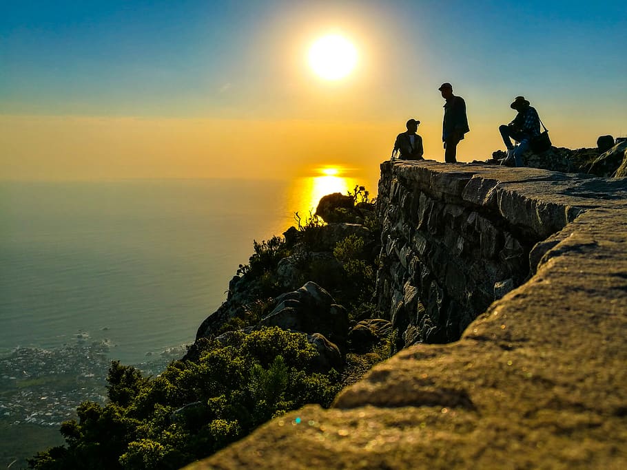 Three Men On Mountain Cliff, dawn, ocean, rock, sea, sky, sun HD wallpaper