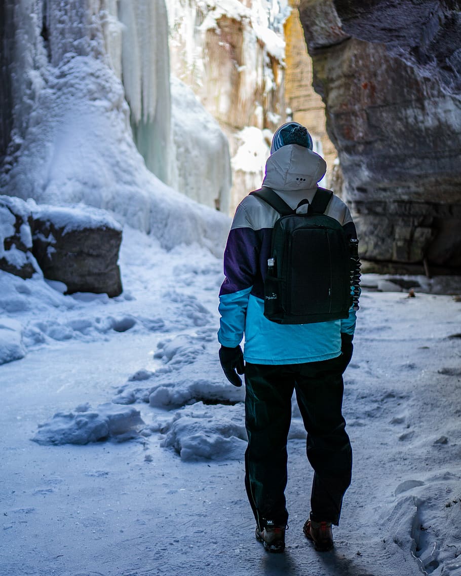 man standing under cave, person, human, outdoors, nature, ice HD wallpaper