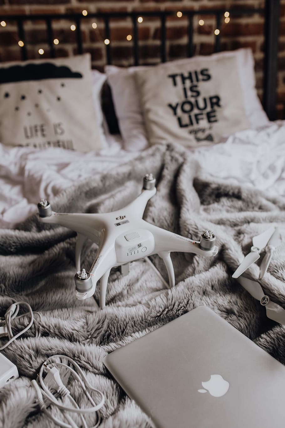 Drone, laptop and accessories lie on the bed ready for travel, HD wallpaper