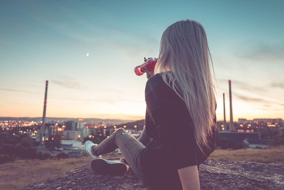 Young Woman Drinking Lemonade and Overlooking the City, alcohol