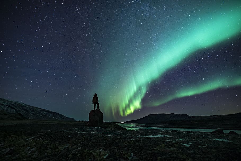 silhouette of person under Northern lights, night, star - space