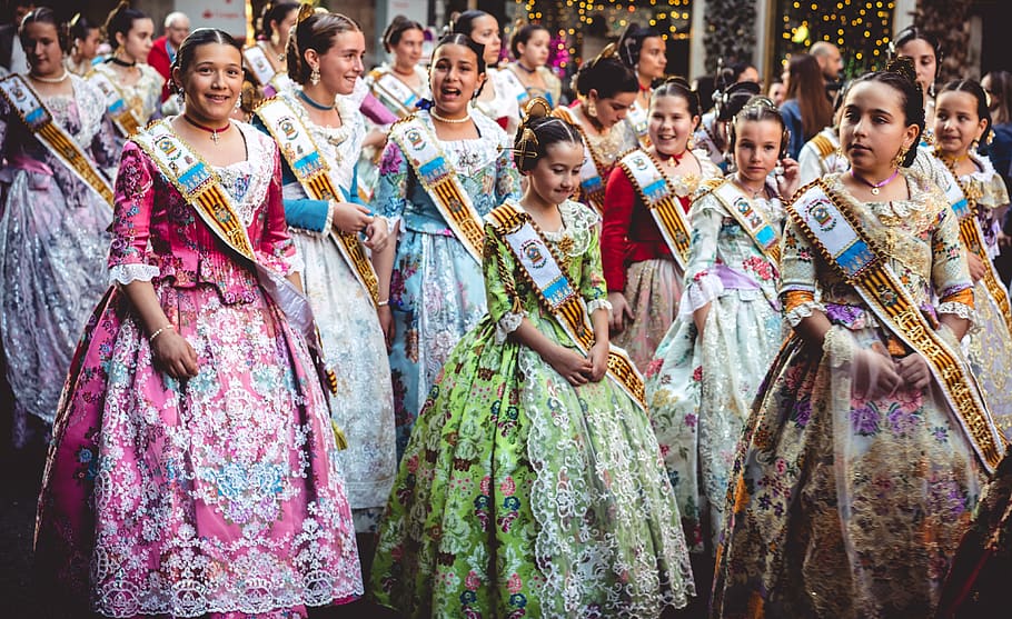 women wearing dress with sash during daytime, human, crowd, festival