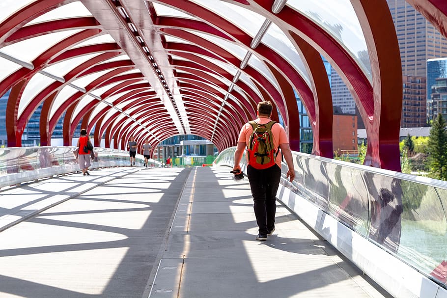 man walking on arch bridge, person, people, human, calgary, building HD wallpaper