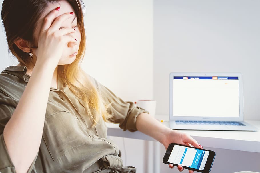 Young sad woman looking for work on the internet, technology HD wallpaper