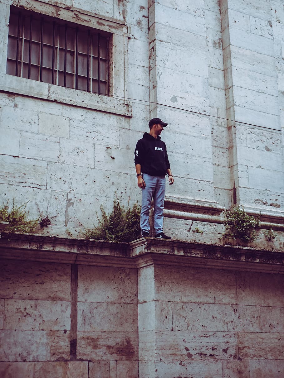 Man in Black Hooded Jacket Standing on Edge, architecture, building HD wallpaper