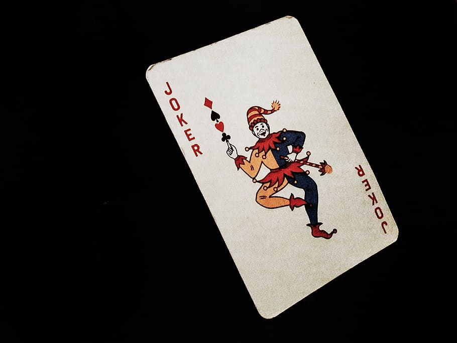 Joker card on black background Desktop wallpapers 1920x1200