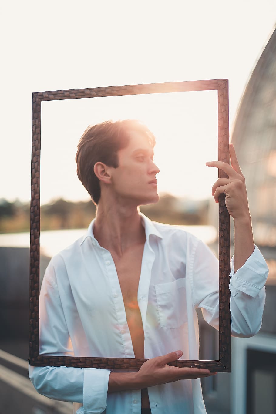 Man Holding Black Frame in Front of His Face, concept, daylight HD wallpaper