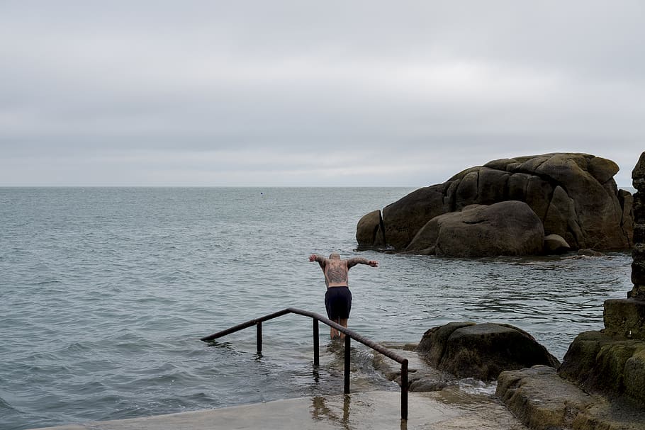 man diving on ocean during daytime, human, person, promontory HD wallpaper