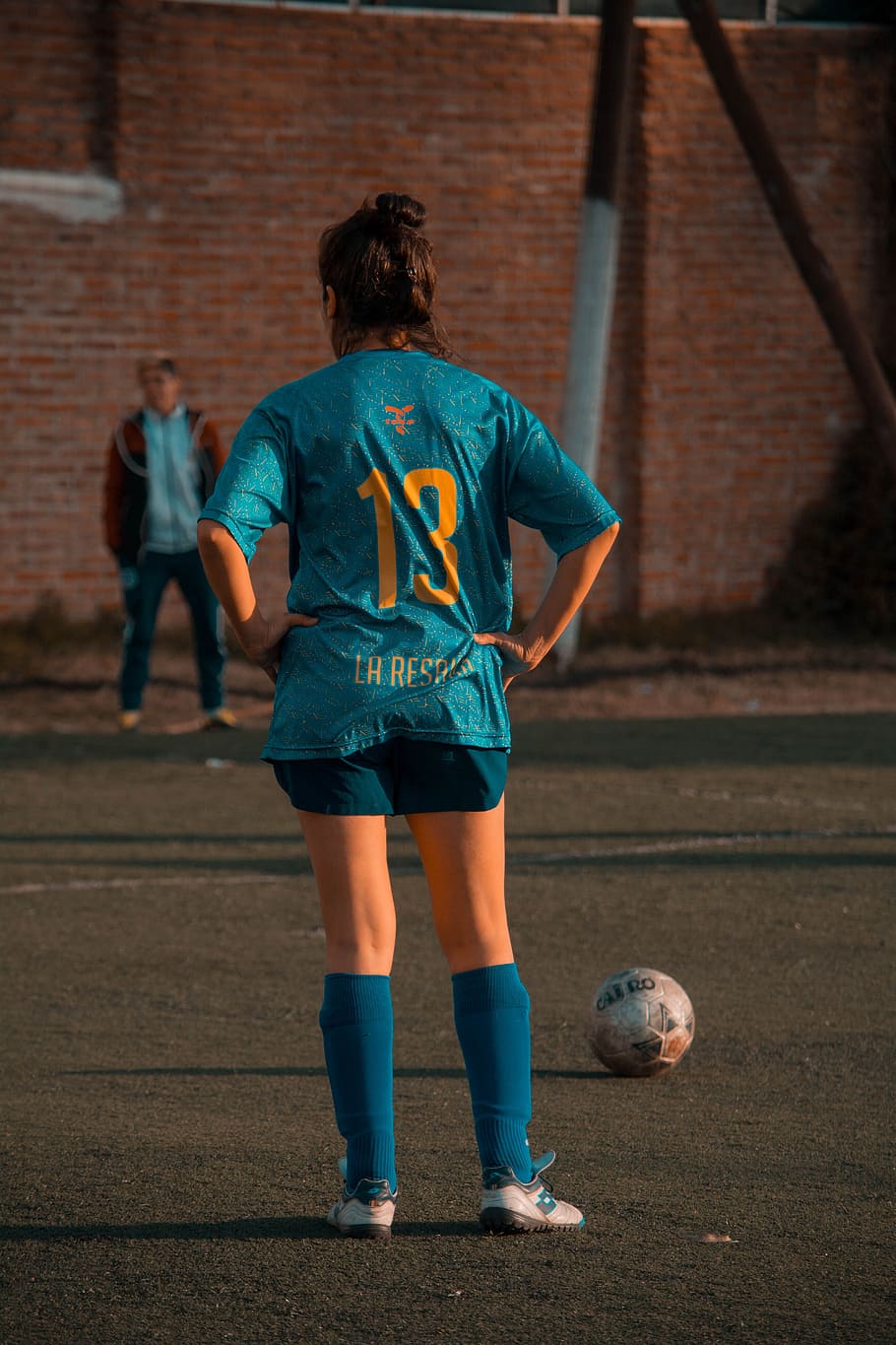 Person In Blue Soccer Jersey Standing In Front Of Ball, athlete