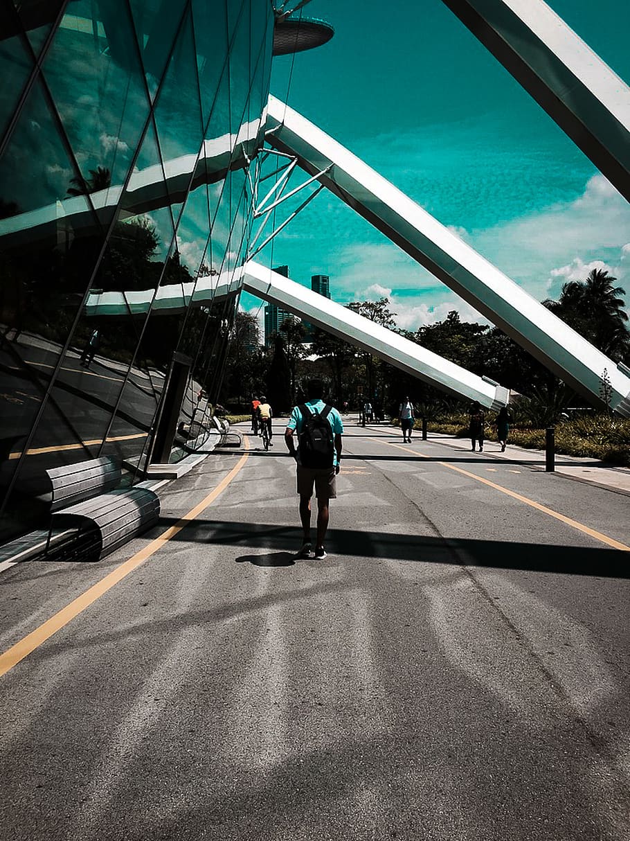 Man Standing Beside Glass Curtain, architecture, bench, building HD wallpaper