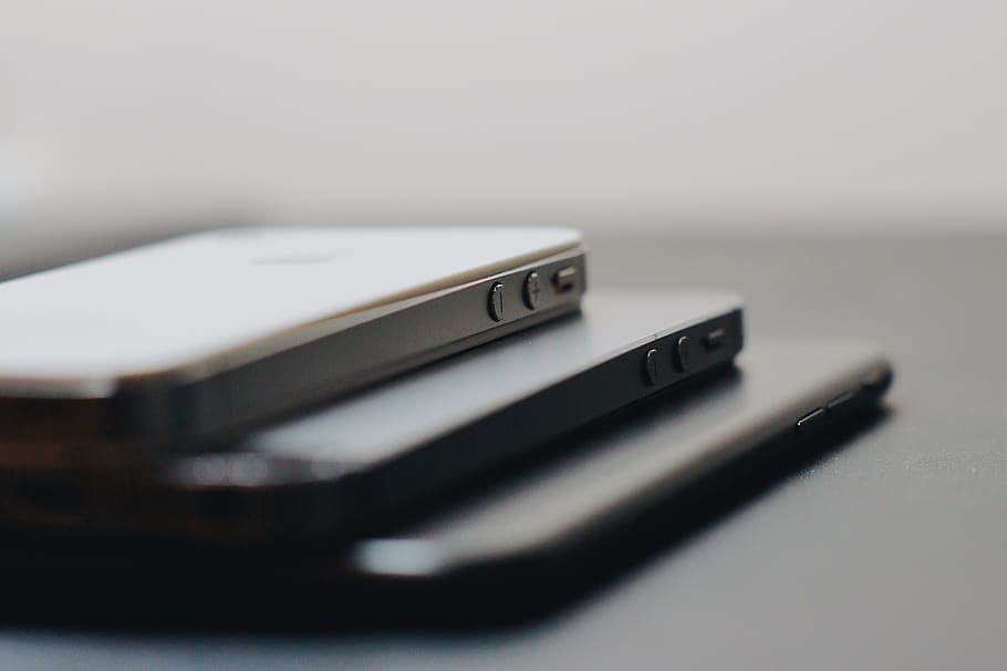 three iPhoneson black surface, poland, pabianice, grey, technology HD wallpaper