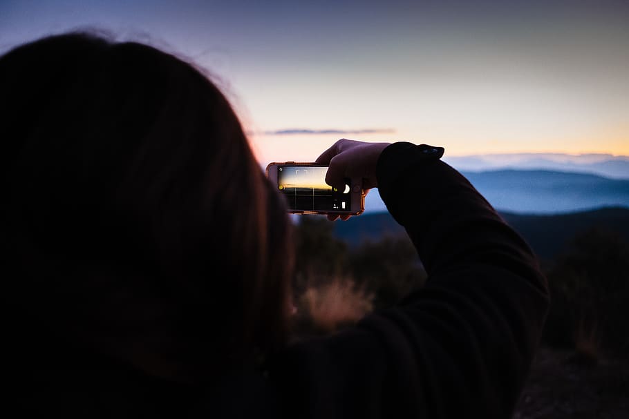 person using smartphone outdoor, human, outdoors, nature, photo HD wallpaper
