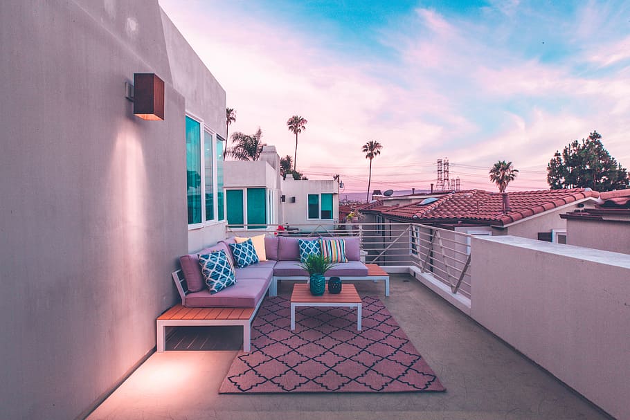 brown wooden sectional bench on top of white concrete house balcony HD wallpaper