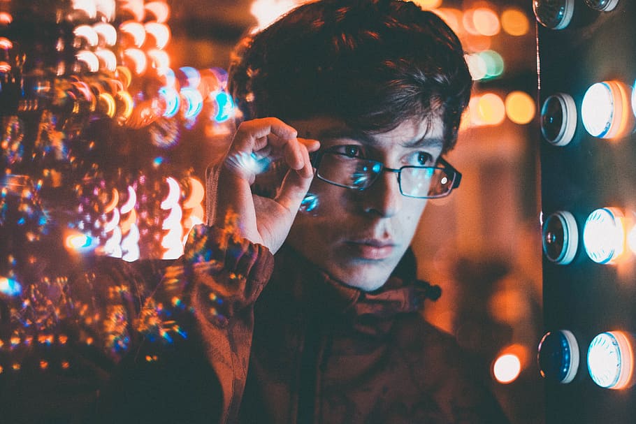 man holding his eyeglasses, light, prisma, neon, cool, urban