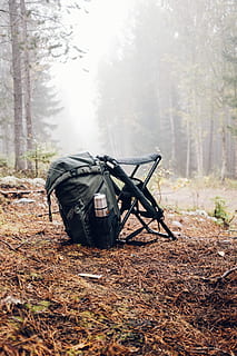 black and gray backpack with camping chair on forest, tree, woodland HD wallpaper