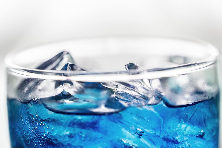 Blue Beverage in Glass, blurred background, clear, close-up, cold