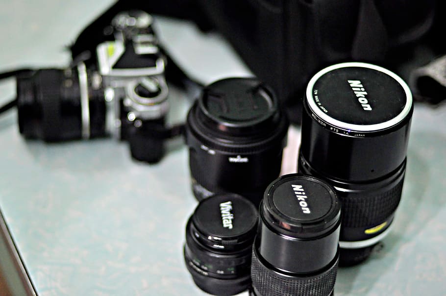 Four Black Nikon Zoom Camera Lens, aperture, blurred background